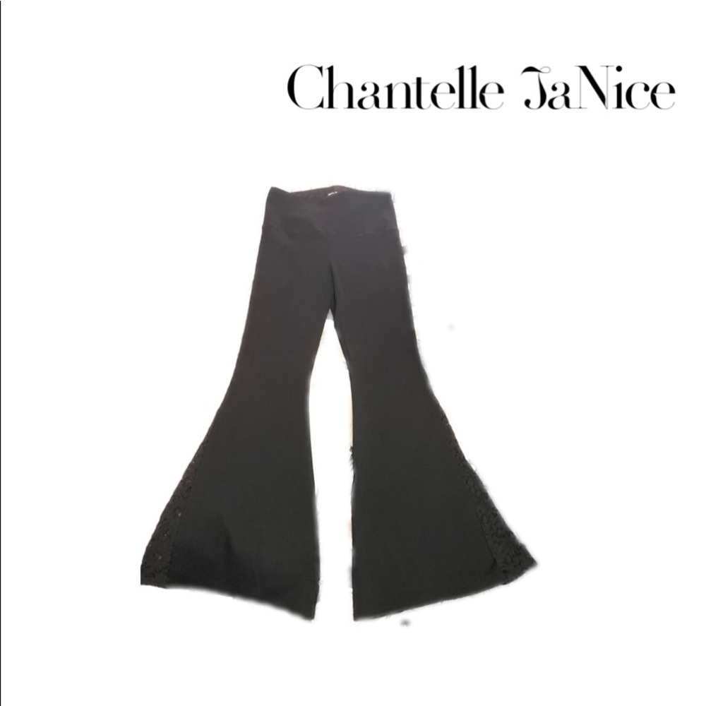 Boot leg flare pants. Black. Athena Marie. Size Medium. Lace slit.